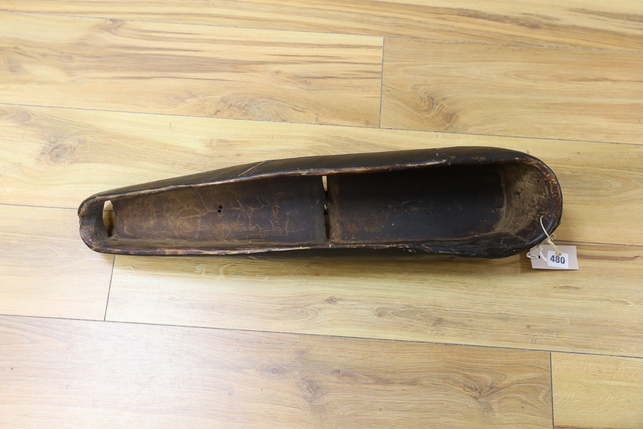 An African carved and painted wood mask. 64cm long